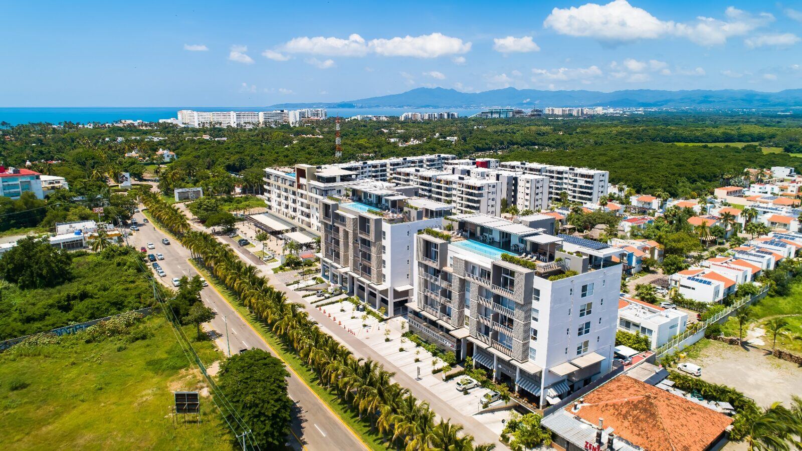 Departamentos en venta en Nuevo Vallarta — vista aérea del complejo Punto Novo frente al mar de la Riviera Nayarit con amenidades de lujo